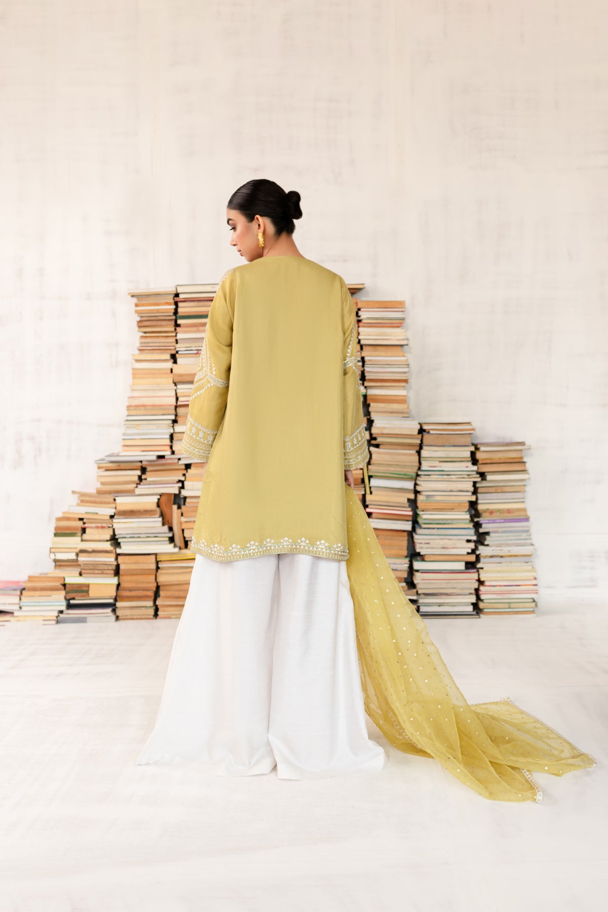 Model in a back shot wearing Cotton silk shirt with silk pants and organza dupatta