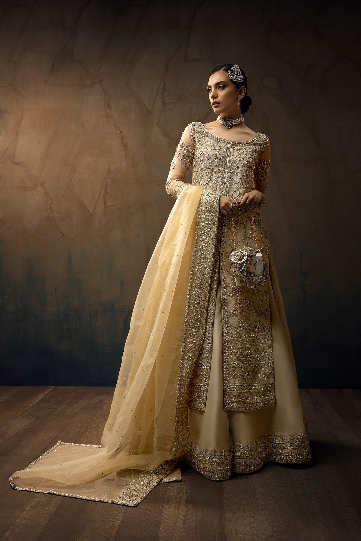 Model wearing a cream yellow front open orgenza long shirt with sharara by Zuria Dor