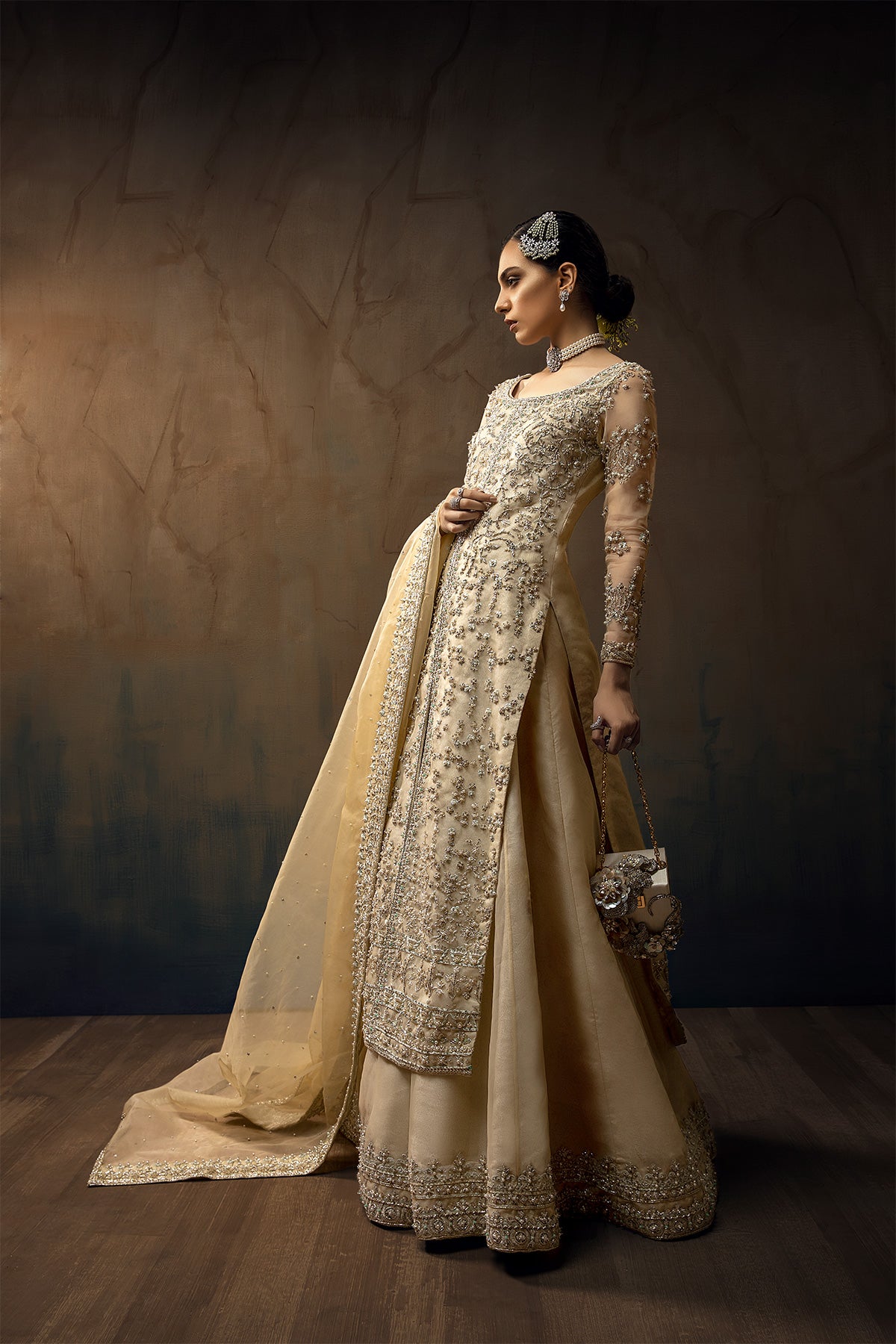 Model wearing a cream yellow front open orgenza long shirt with sharara by Zuria Dor