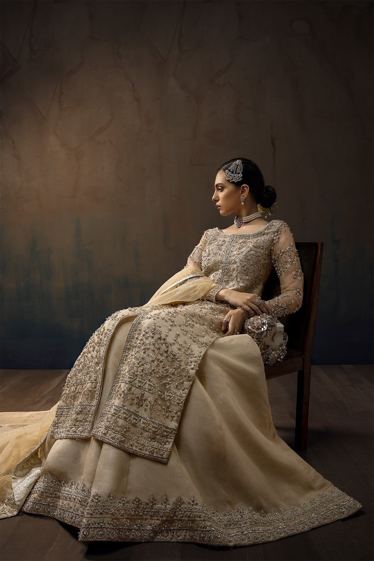 Model wearing a cream yellow front open orgenza long shirt with sharara by Zuria Dor
