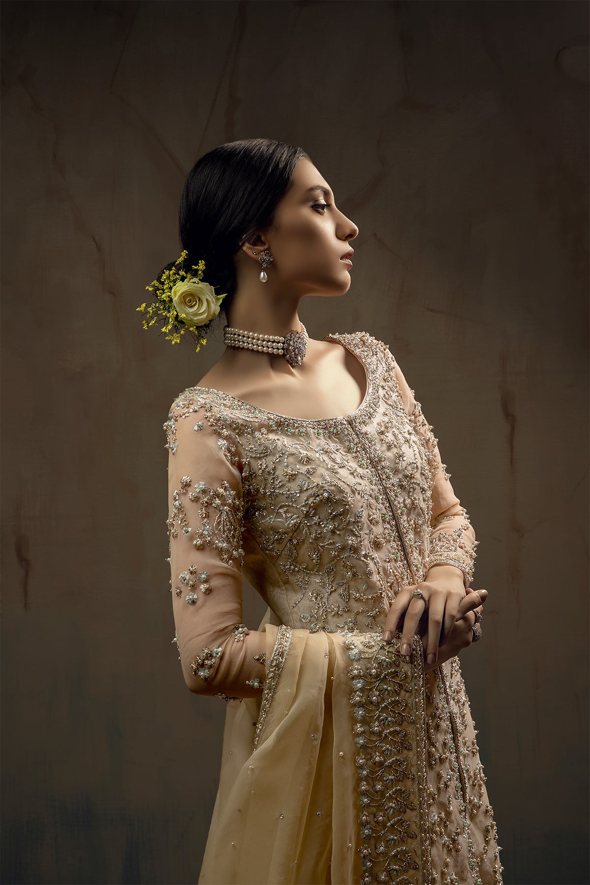 Model wearing a cream yellow front open orgenza long shirt with sharara by Zuria Dor