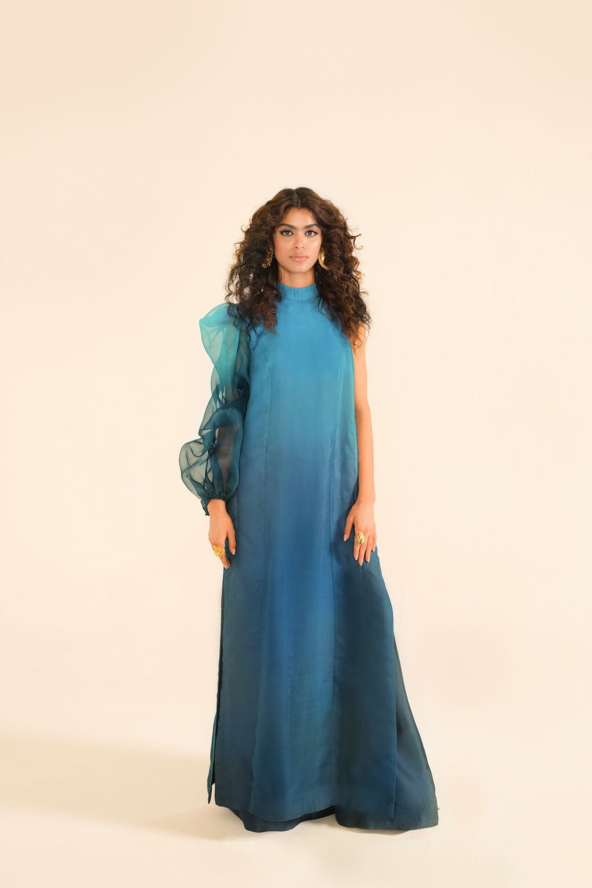 Model in a closeup shot wearing ombre silk organza shirt with silk organza drape attached
