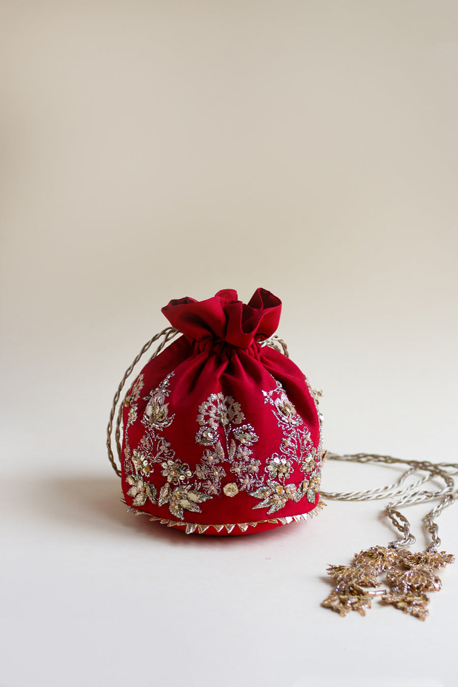 Full shot of red raw silk pouch